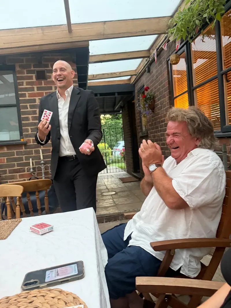 A guest laughing during Matt Parrou2019s after-dinner show