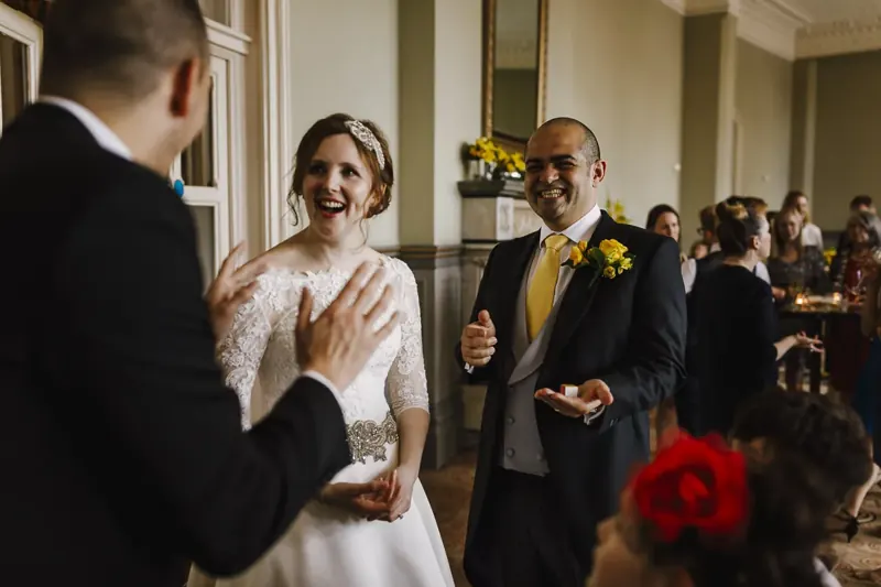 Bride amazed and groom smiling at Matt Parrou2019s magic