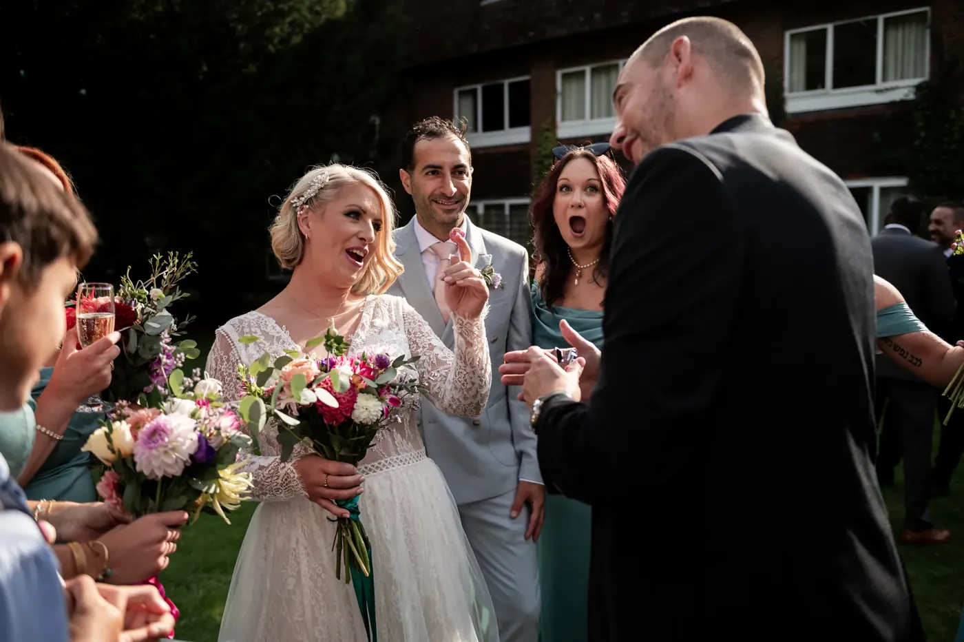 Bride and bridesmaid amazed by wedding magician Matt Parro in the garden