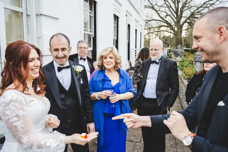 Bride and wedding guests reacting to Matt Parrou2019s mind reading
