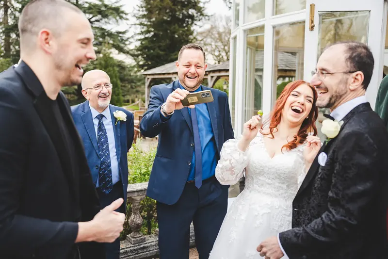 Bride, groom and guests delighted by a trick