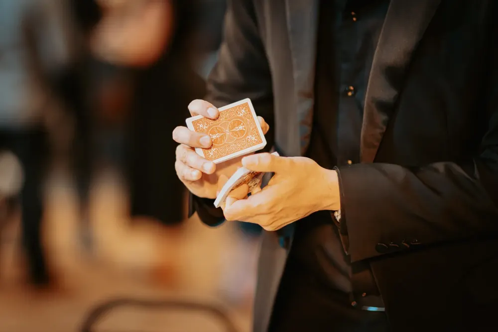 Close-up of a magicianu2019s hands with a deck of cards