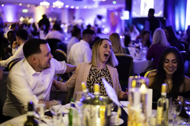 Corporate guests screaming with delight at Matt Parro's magic at an end-of-year awards dinner