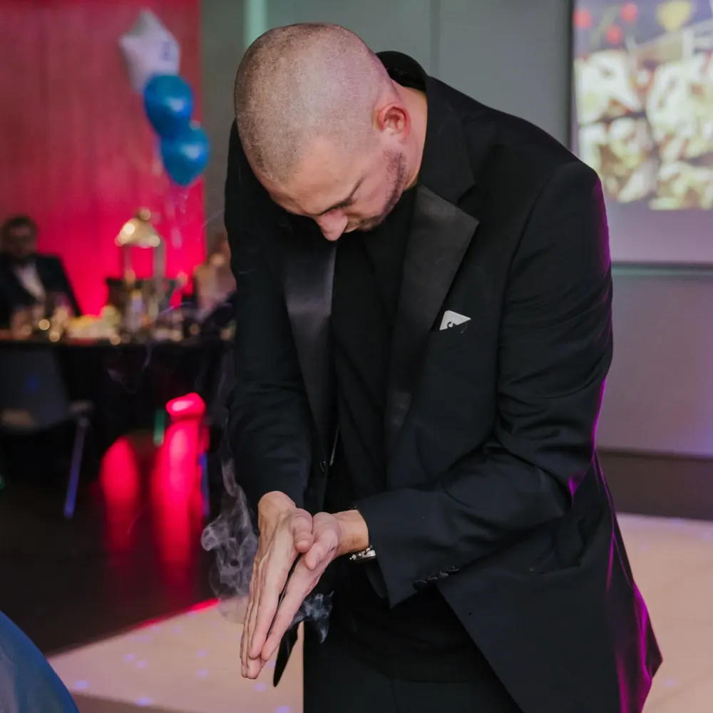 Essex magician Matt Parro performing a smoke trick