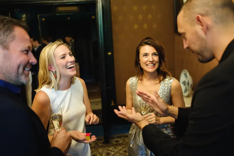 Corporate guests delighted by a magic reveal
