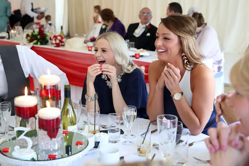 Guests delighted at a candlelit dinner