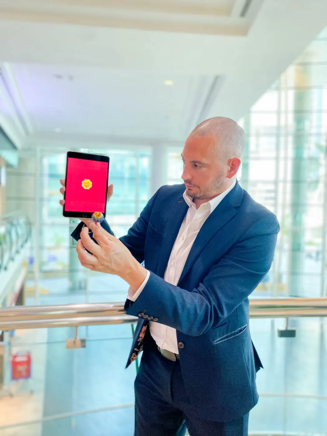 iPad magician Matt Parro performing a digital magic trick with a tablet