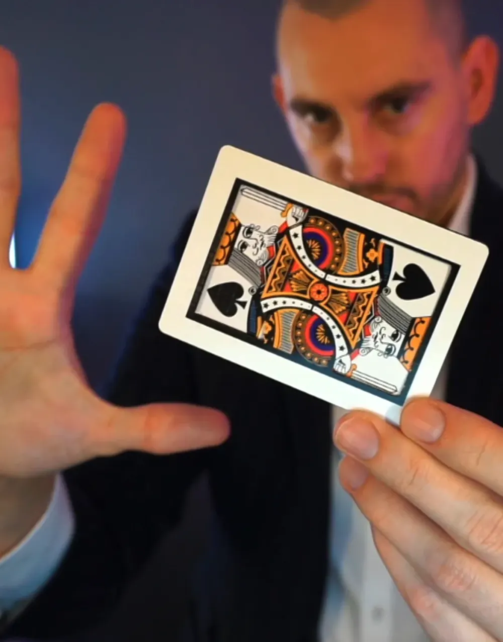 Magic consultant Matt Parro holding a playing card
