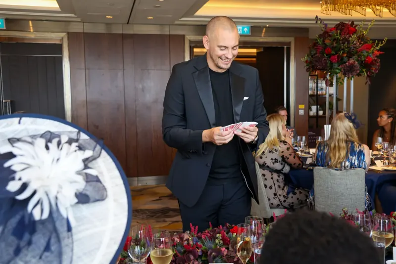 Matt Parro performing close-up magic at a private party in a restaurant