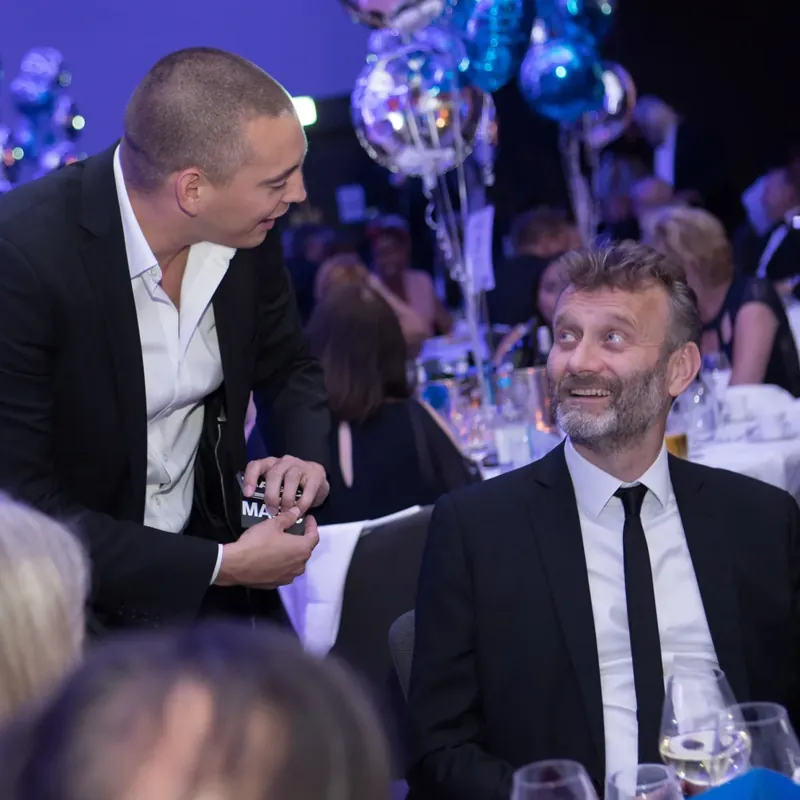 Matt Parro performing for Hugh Dennis