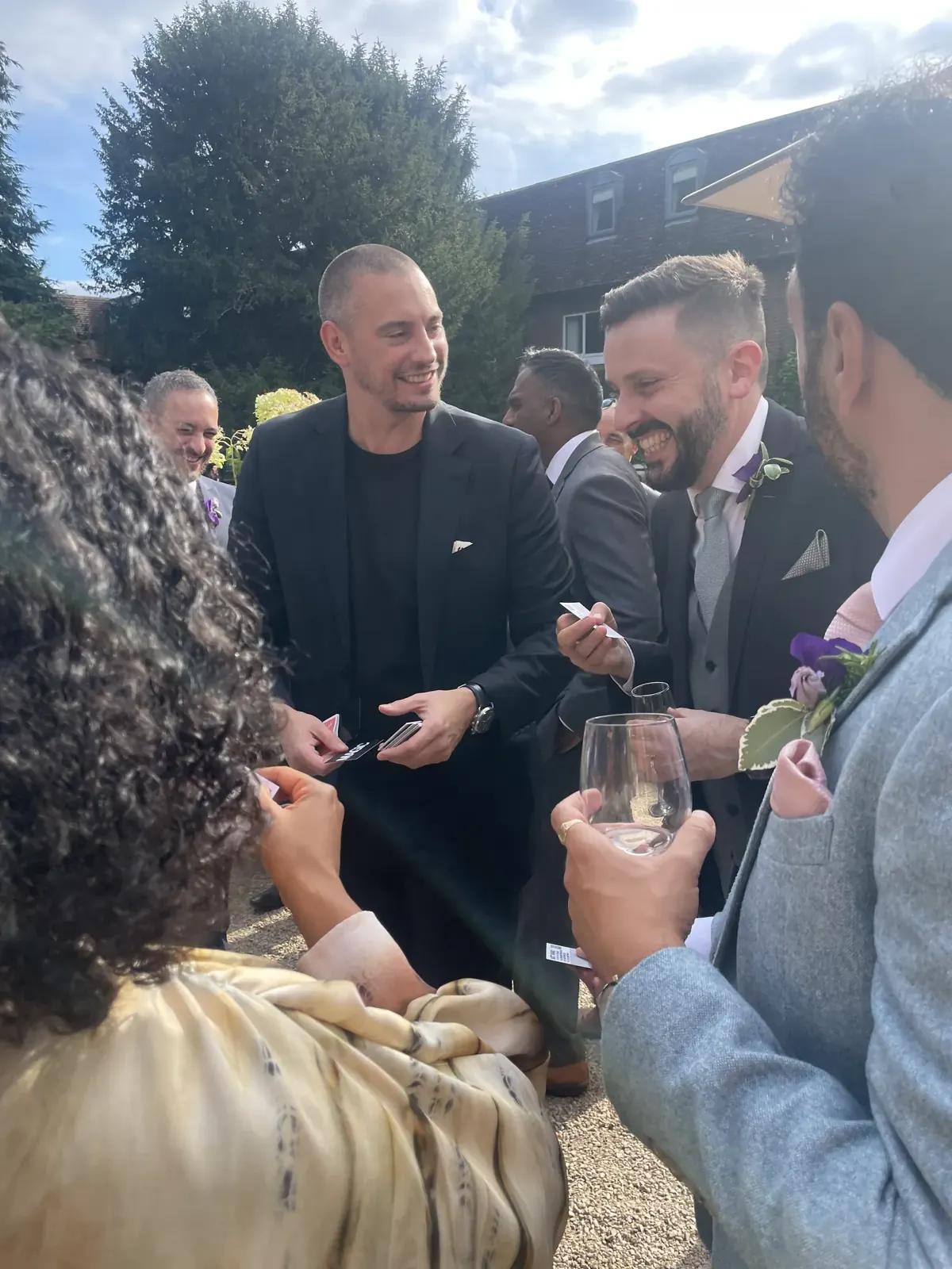 Matt Parro performing for the groom and groomsmen at a garden drinks reception