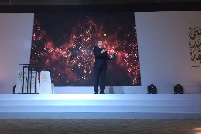 Matt Parro performing on stage at a conference