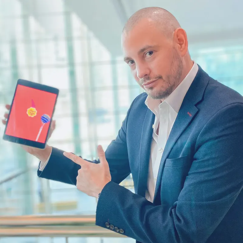 Matt Parro pointing at an iPad trick