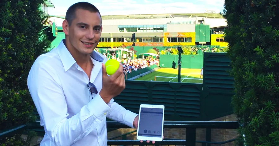 Matt Parro producing a tennis ball from an iPad for HSBC at Wimbledon