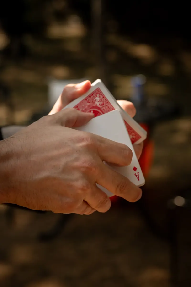 Matt Parrou2019s hands revealing a playing card