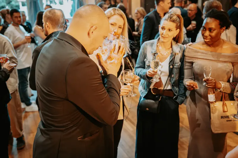 Party guests shocked at a magic reveal by magician Matt Parro