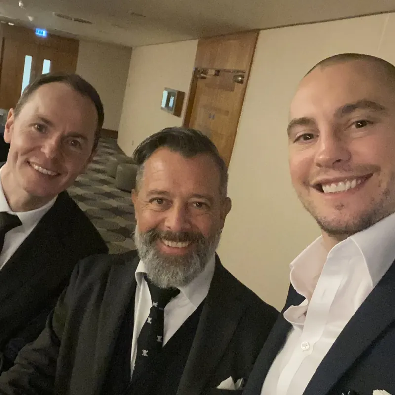 Three magicians at a hotel event